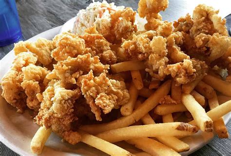 fried chicken and french fries on a white plate