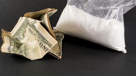 Big Bag Of Cocaine And Crumpled Us Dollars Stock Photo - Download Image Now - iStock