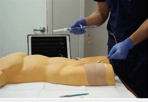 REBOA insertion trainer in use. The participant is advancing the... | Download Scientific Diagram