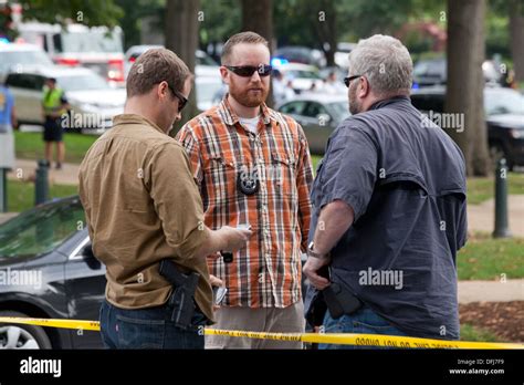 Plain clothes police officers meeting at a crime scene - Washington Stock Photo, Royalty Free ...