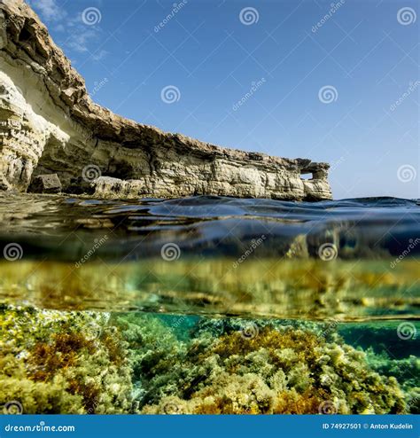 View of the Cliffs and Sea Caves of Cape Greco from Under the Wa Stock Image - Image of ...