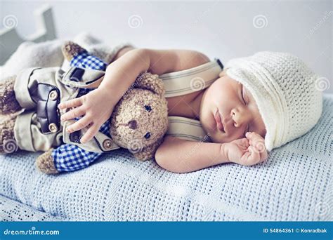 Newborn Child Sleeping with a Teddy Bear Stock Image - Image of dreams, little: 54864361