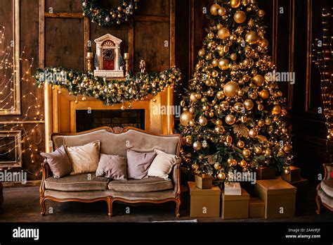 Christmas background with illuminated fir tree with golden decpration ...