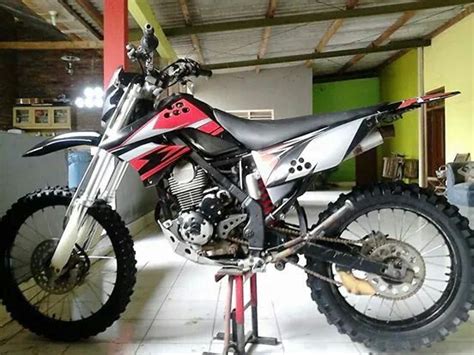 Red and White KLX 150 Off Road Bike