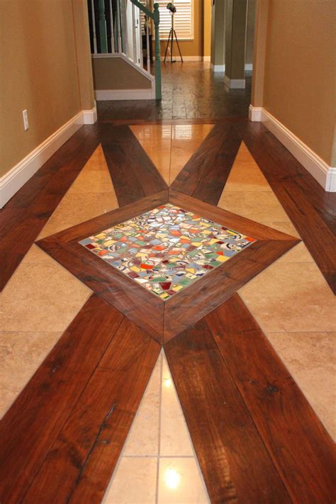 Entry floor design - distressed walnut hardwood, travertine tiles, broken mexican tiles to ...