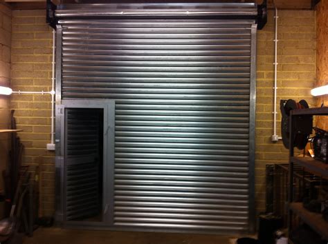 Roller shutter door with a wicket door incorporated. | Shutter doors ...