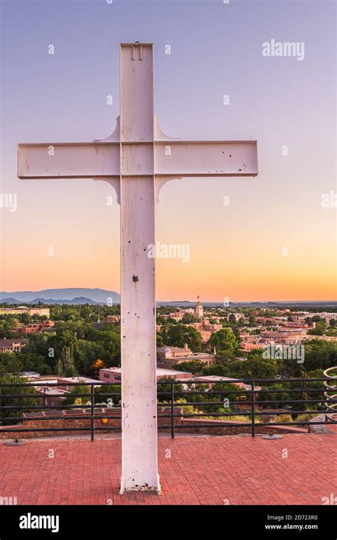 Santa Fe, New Mexico, USA cross and downtown skyline at dusk Stock Photo - Alamy