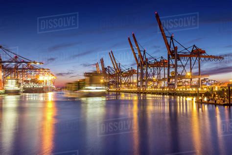 Germany, Hamburg, Port of Hamburg, Container Terminal, container cranes and container ships in ...