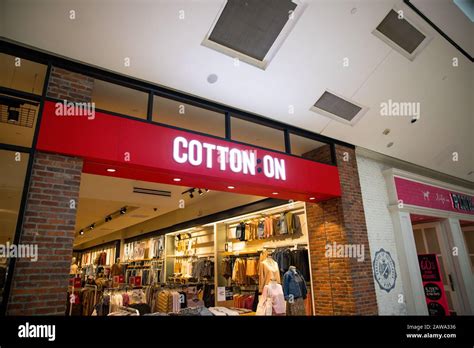 Cotton on clothe shop front store sign Stock Photo - Alamy