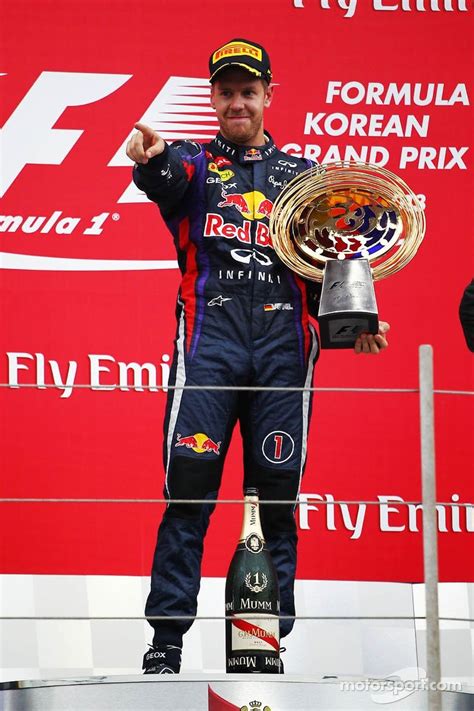 Race winner Sebastian Vettel, Red Bull Racing celebrates on the podium ...