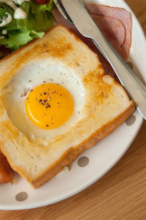 Egg in a Hole Recipe - buttery toasted bread with a fried egg in the center. A quick and easy ...