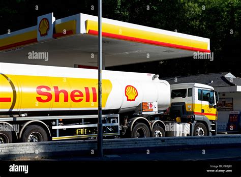 Shell lorry delivering fuel to petrol station in Ulverston, South ...