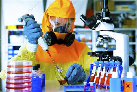 Scientist in hazmat suit - Stock Image - F011/4297 - Science Photo Library