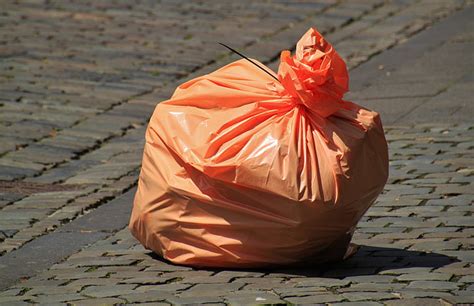 Royalty-Free photo: Photo of orange plastic garbage bag | PickPik