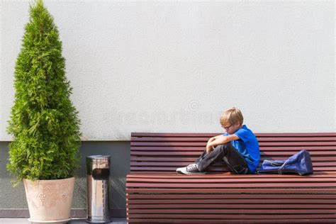 Sad, Tired Child Sitting Alone on the Bench Outdoors. Stock Image - Image of family, outdoors ...