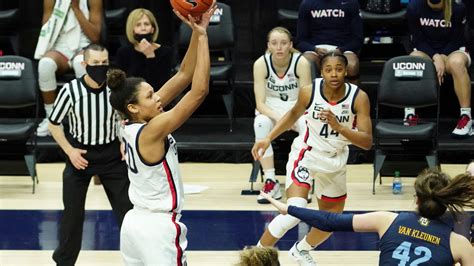 No. 1 UConn ends regular season by beating Marquette 63-53