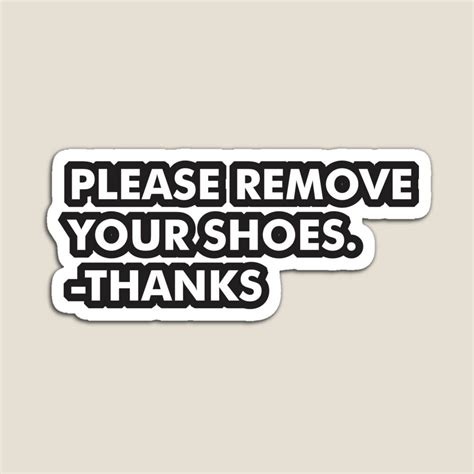 a sticker that says, please remove your shoes thanks with black ...