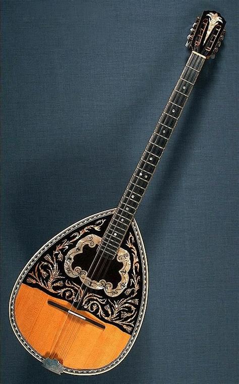 This is a Greek bouzouki. It is the central instrument in all greek music, and it gives greek ...