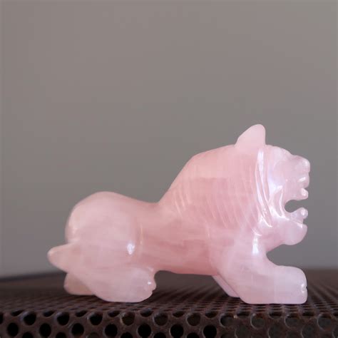 What's this lion roaring about? Don't worry, carved in genuine pink Rose Quartz, this crystal ...