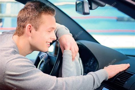 Handsome man cleaning his car — Stock Photo © yacobchuk1 #64978809