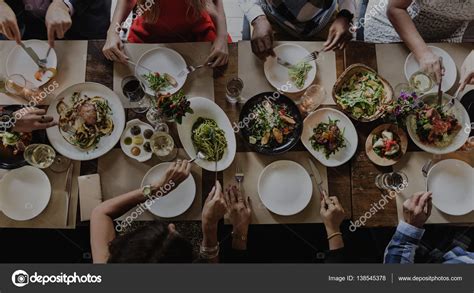 People eating in restaurant — Stock Photo © Rawpixel #138545378