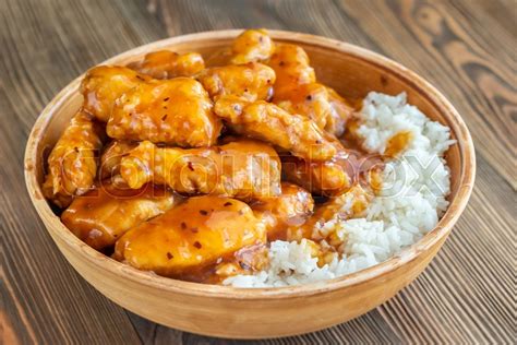 Bowl of orange chicken with white rice | Stock image | Colourbox