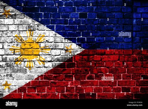 National flag of Philippines on a brick background. Concept image for Philippines: language ...