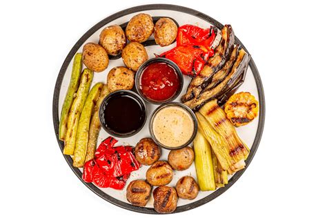 Grilled vegetables in a foil container on a white background - Creative ...