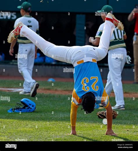 Honolulu, Hawaii's Aukai Kea (23) does a cartwheel while celebrating winning the Little League ...