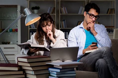 The Two Students Studying Late Preparing For Exams Stock Image - Image ...