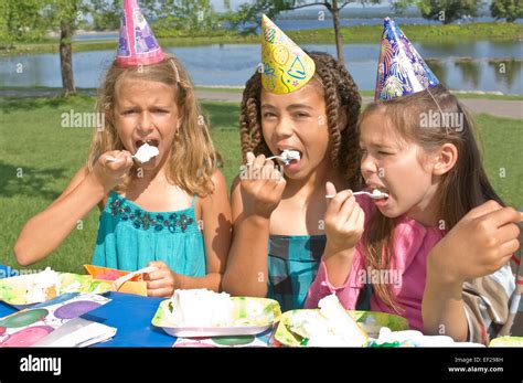 Children eating birthday cake Stock Photo - Alamy