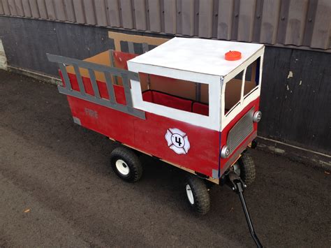 Cardboard fire truck wagon | Diy halloween costumes, Fall fun, Halloween diy