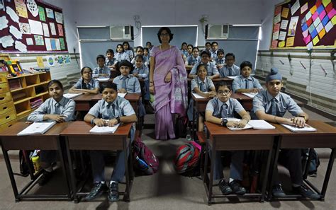 In New Delhi, India, Archana Shori teaches 7th-grade students inside their classroom at Rukmini ...