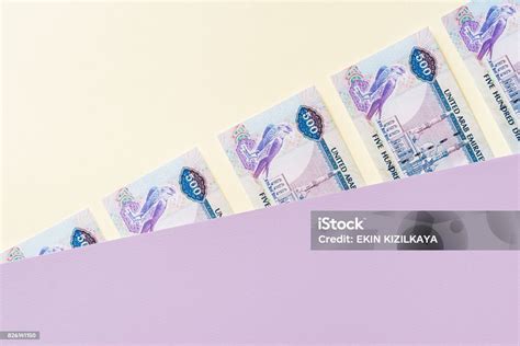 Emirati Dirham Banknotes Between Pastel Colored Layers Stock Photo ...