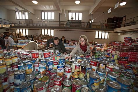 Volunteers At A Food Bank Photograph by Jim West - Fine Art America