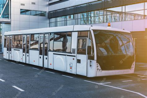 Premium Photo | Airport shuttle bus near the terminal