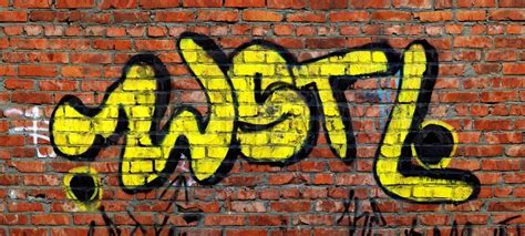 Yellow graffiti on red brick wall | Stock Photo | Colourbox