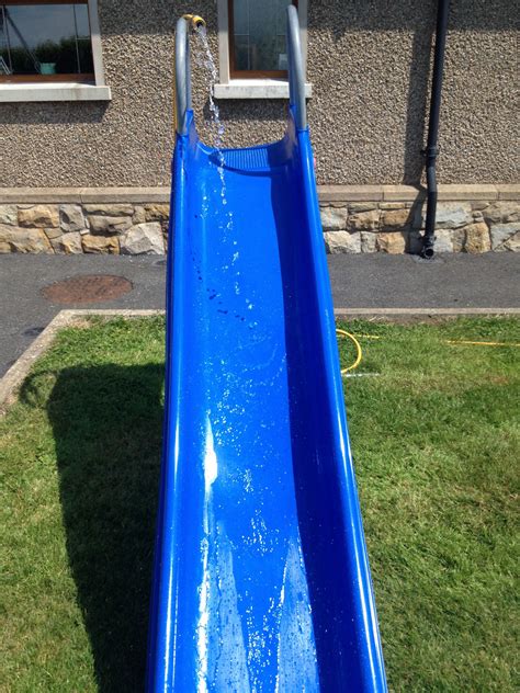 Fun DIY water slide with a hose and a slide great fun and very family and friend orientated ...