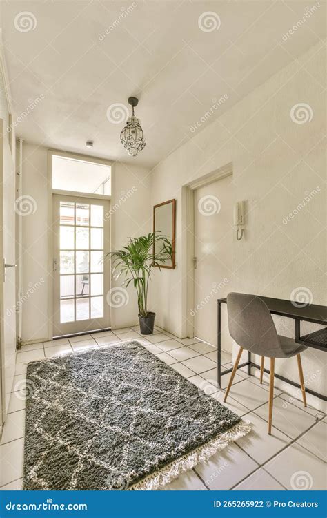 A Living Room with a Chair and a Rug and Stock Photo - Image of parquet, interior: 265265922