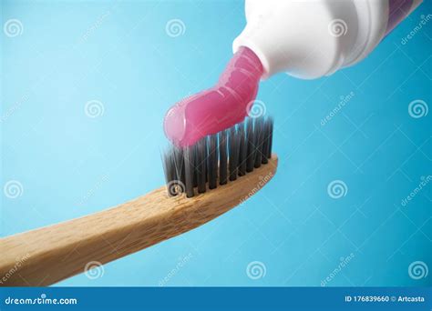 Pink Toothpaste on a Natural Bamboo Toothbrush Stock Photo - Image of ...