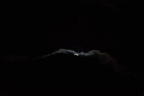 A full moon with clouds in the black night sky. Full moon on January 31, 2018. A supermoon ...