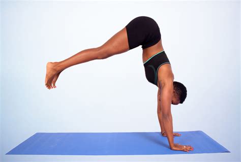 Woman Doing Beginner Handstand Yoga Pose on Yoga Mat