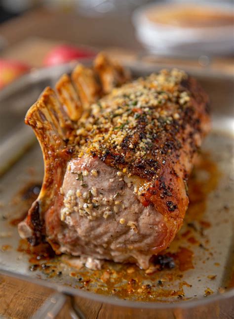 Roasted Rack of Pork is a show-stopping, holiday main dish crusted with garlic, fresh thyme and ...