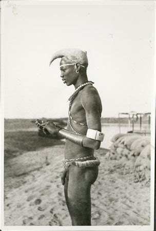 Nuer youth with thiau arm-rings (1998.346.366) from the Southern Sudan ...