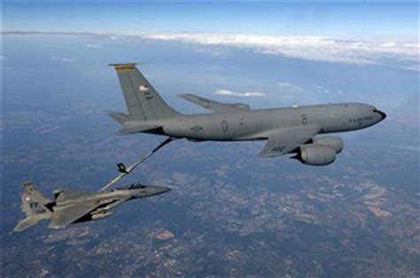 An F-15 Eagle aircraft receives fuel from a KC-135 Stratotanker aircraft.