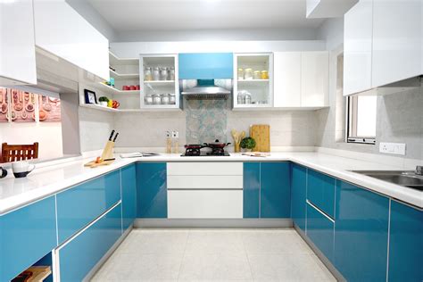 a kitchen with blue cabinets and white counter tops