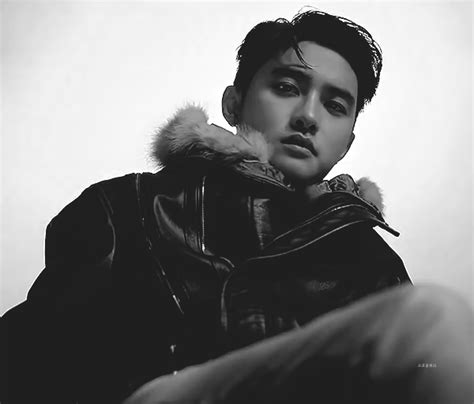 a black and white photo of a person wearing a leather jacket with a fur ...