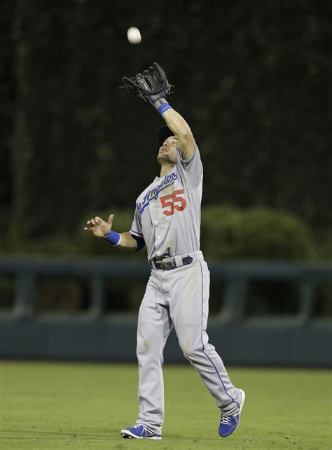 Skip Schumaker #55 of the Los Angeles Dodgers catches a fly ball hit by ...