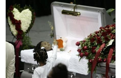 Tupac Funeral Home / Pall bearers place the coffin containing the body ...