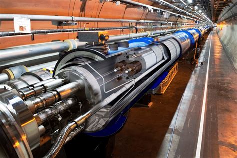 View of the LHC tunnel with an artistic cut through a LHC dipole ...